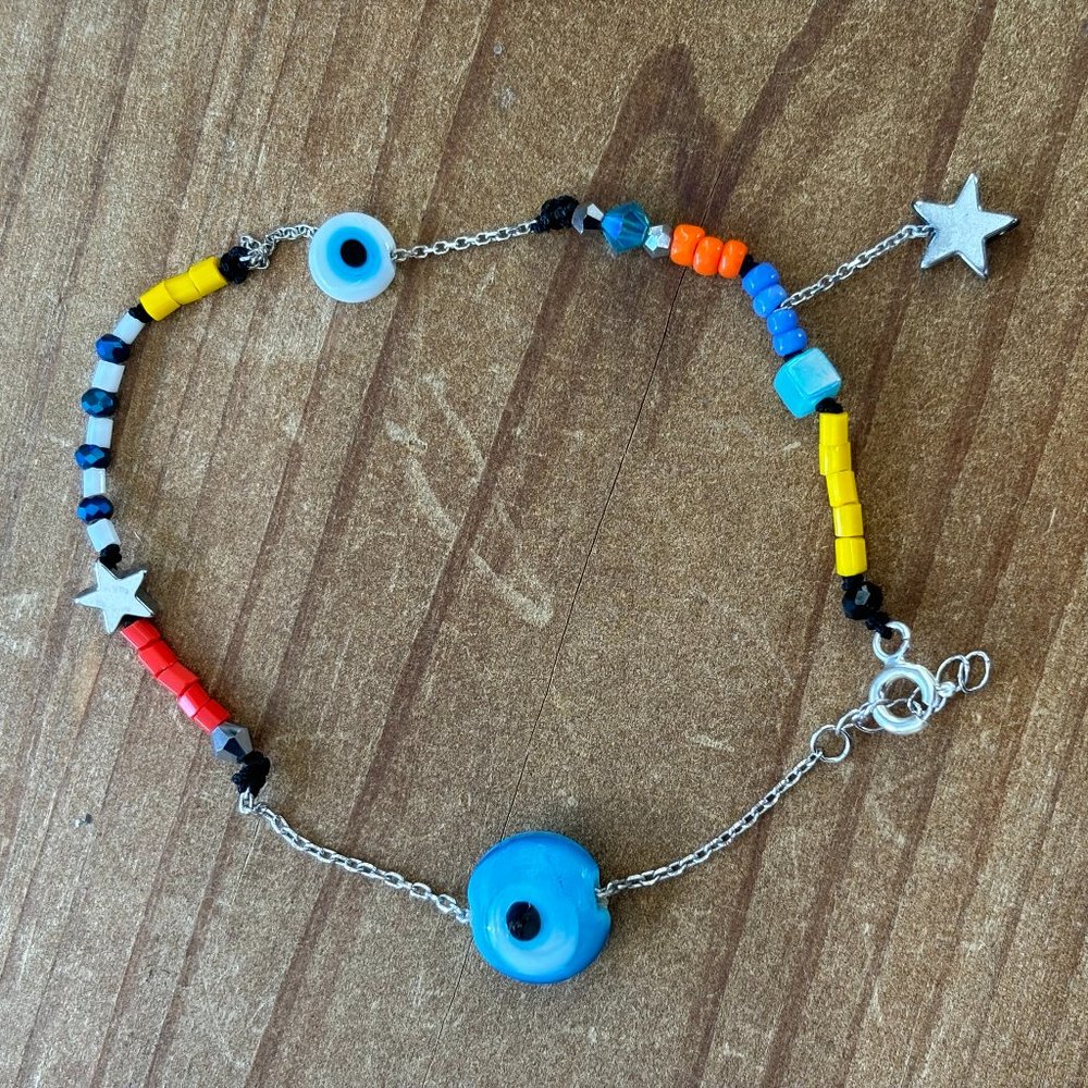 Handmade silver swinging star anklet